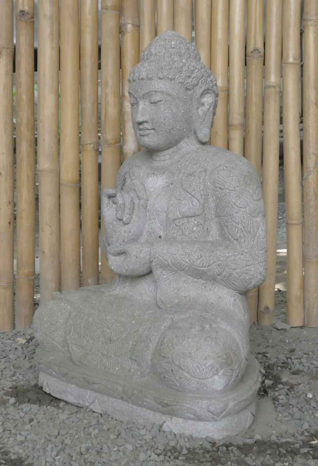  Product image 7 of the product “Seated Buddha with floral carving, Dharmacakra position. 67 cm height. Natural stone (river stone), stonemasonry. There is a stone eye in the chest. ”